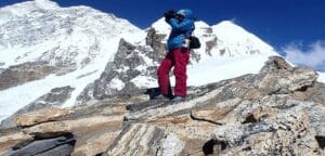 Trekker capturing the snowy peaks of Mount Makalu during the Makalu View Trek in eastern Nepal