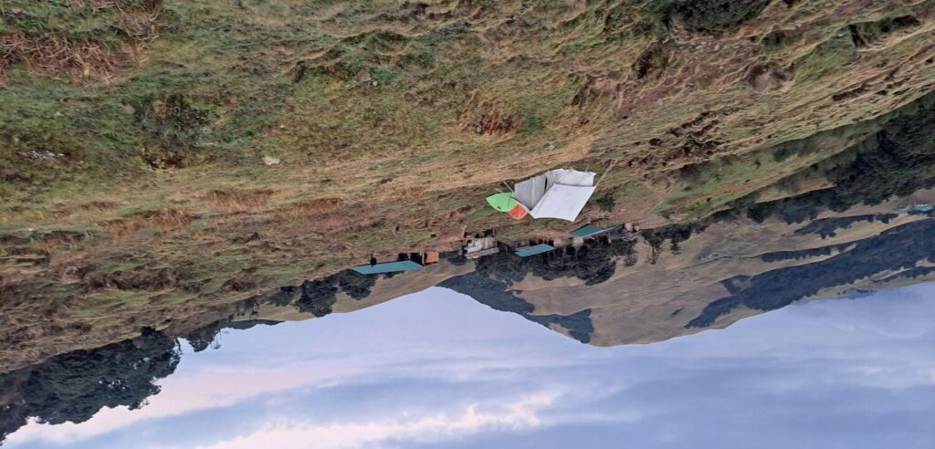 Sunrise over Dhotre village with terraced fields along the trekking route in Eastern Nepal
