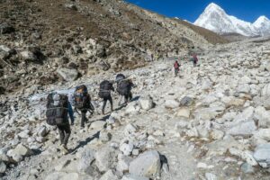 Sherpa porters trekking toward Everest Base Camp in the Khumbu region