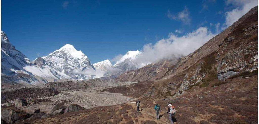 Trekkers hiking through the Himalayan landscape on the Makalu Base Camp Trek in eastern Nepal.