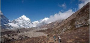 Trekkers hiking through the Himalayan landscape on the Makalu Base Camp Trek in eastern Nepal.