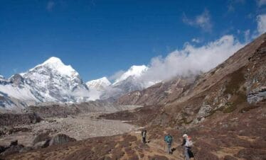 Trekkers hiking through the Himalayan landscape on the Makalu Base Camp Trek in eastern Nepal.