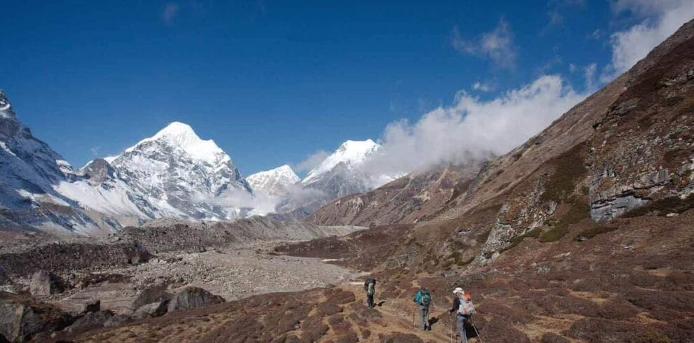 Trekkers hiking through the Himalayan landscape on the Makalu Base Camp Trek in eastern Nepal.