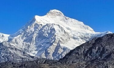 Snow-covered Mount Kanchenjunga viewed on the Kanchenjunga Base Camp Trek in eastern Nepal