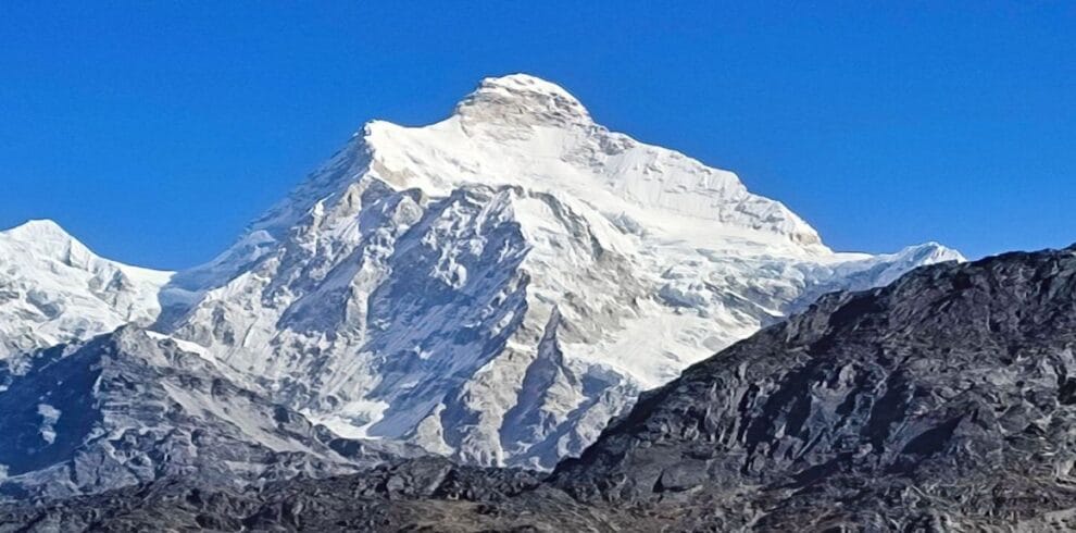 Snow-covered Mount Kanchenjunga viewed on the Kanchenjunga Base Camp Trek in eastern Nepal