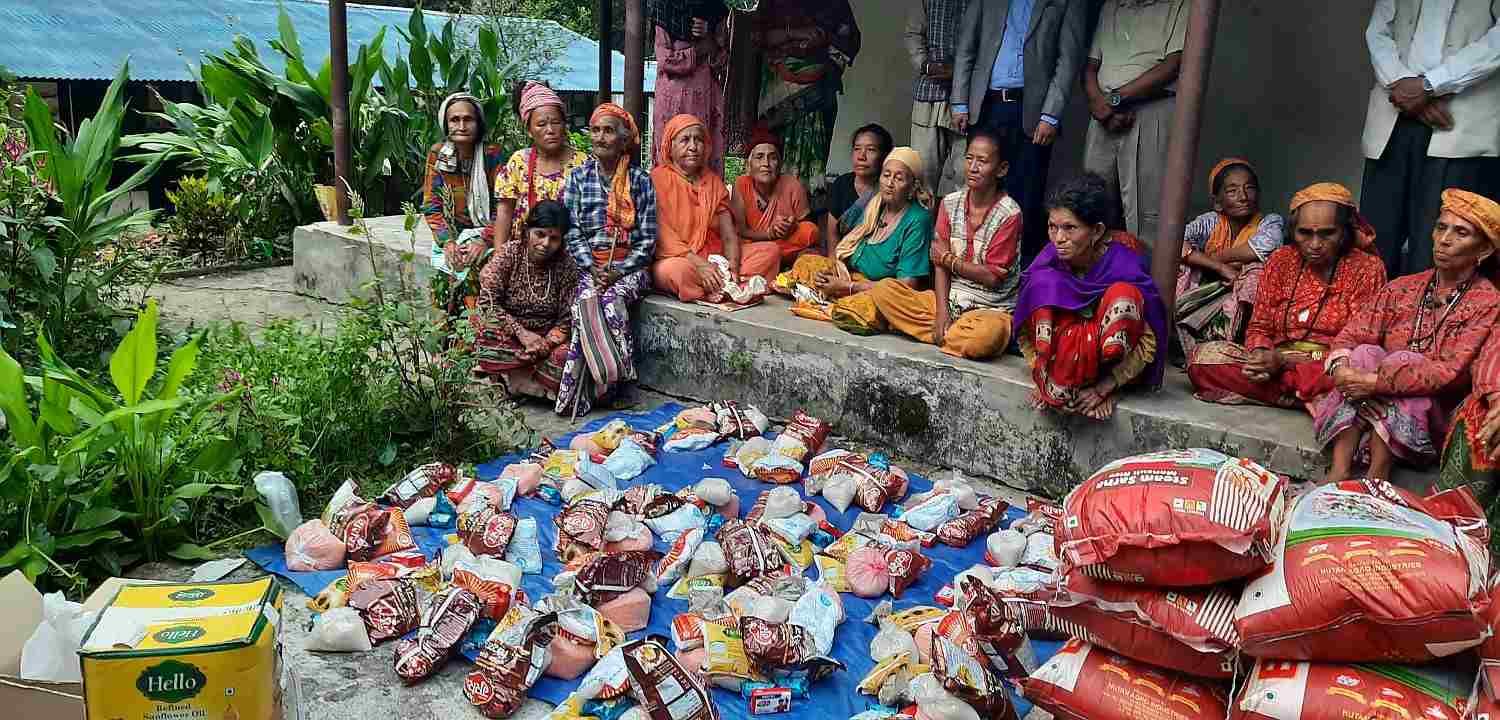 Food distribution for local women and elders under the Mast Community Project.