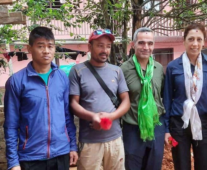 Guests with Local Porter guides and Local Woman.