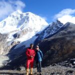 Guest with a local Porter guide on the lap of Mt. Mkalu