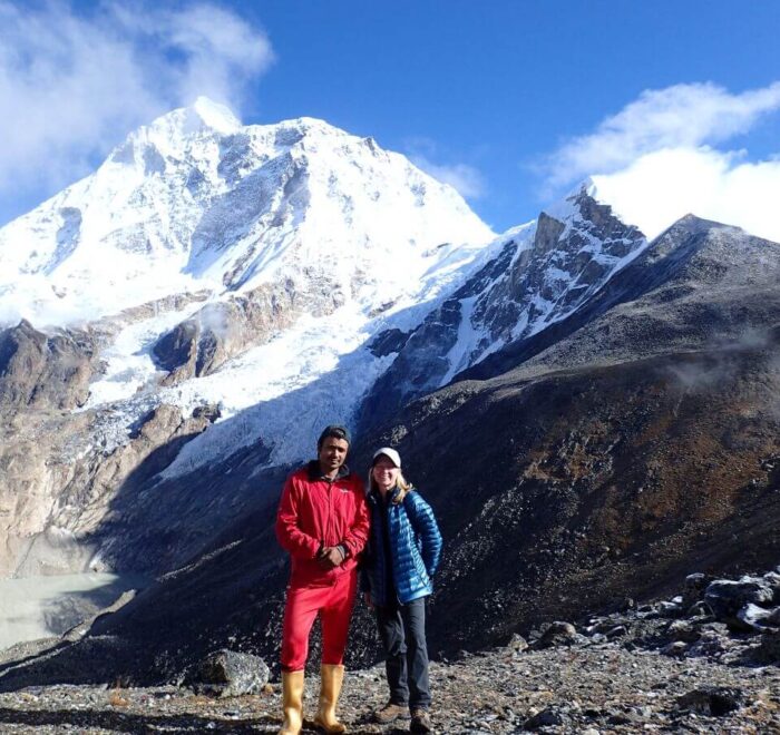 Guest with a local Porter guide on the lap of Mt. Mkalu