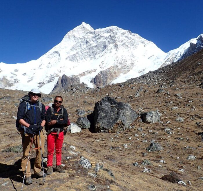 A guest in hiking with a local porter guide