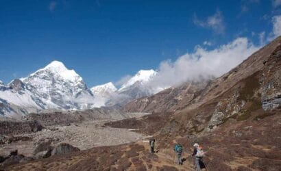 Trekkers hiking through the Himalayan landscape on the Makalu Base Camp Trek in eastern Nepal.
