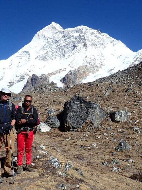 Trekker with local porter-guide during community-based trek in Eastern Nepal