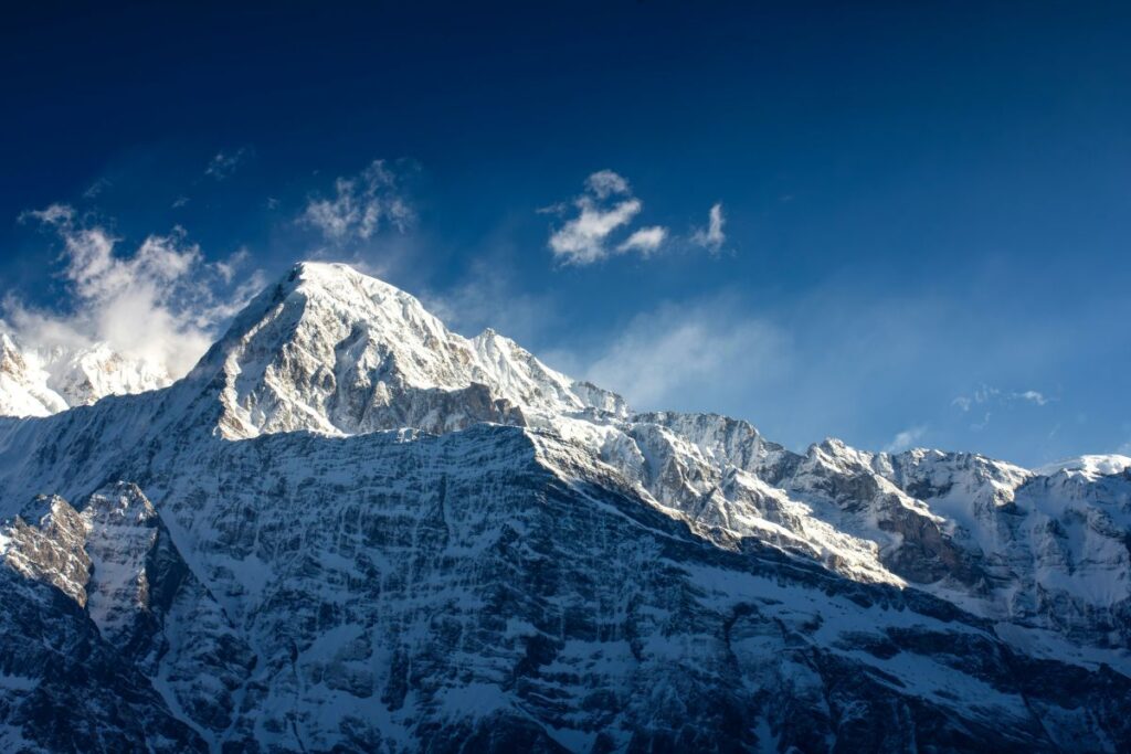 Snow-covered Annapurna South under a deep blue sky, seen from the Mardi Himal Trek, Nepal
