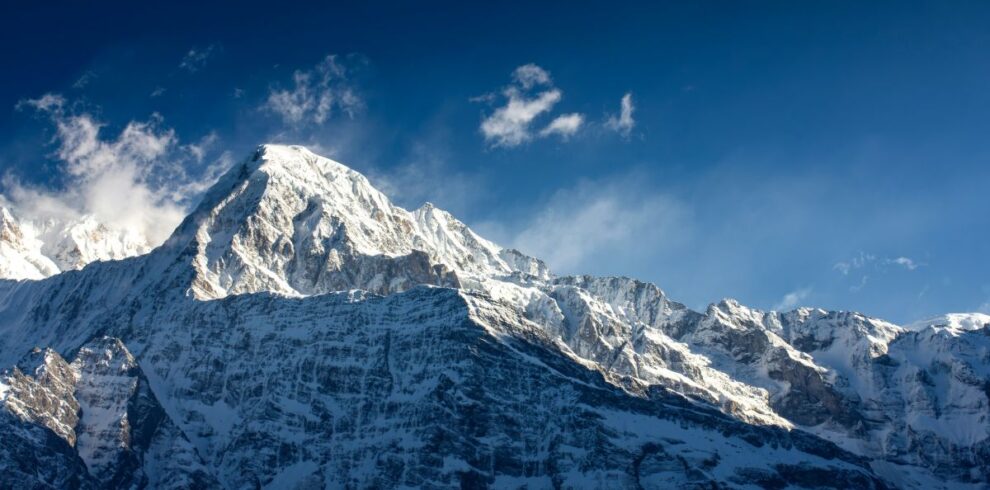 Snow-covered Annapurna South under a deep blue sky, seen from the Mardi Himal Trek, Nepal